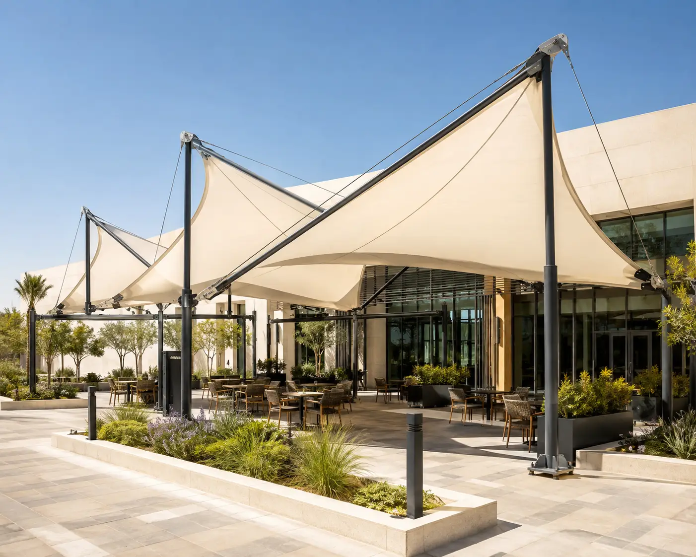 Tensile canopy structure installed at a commercial forecourt.